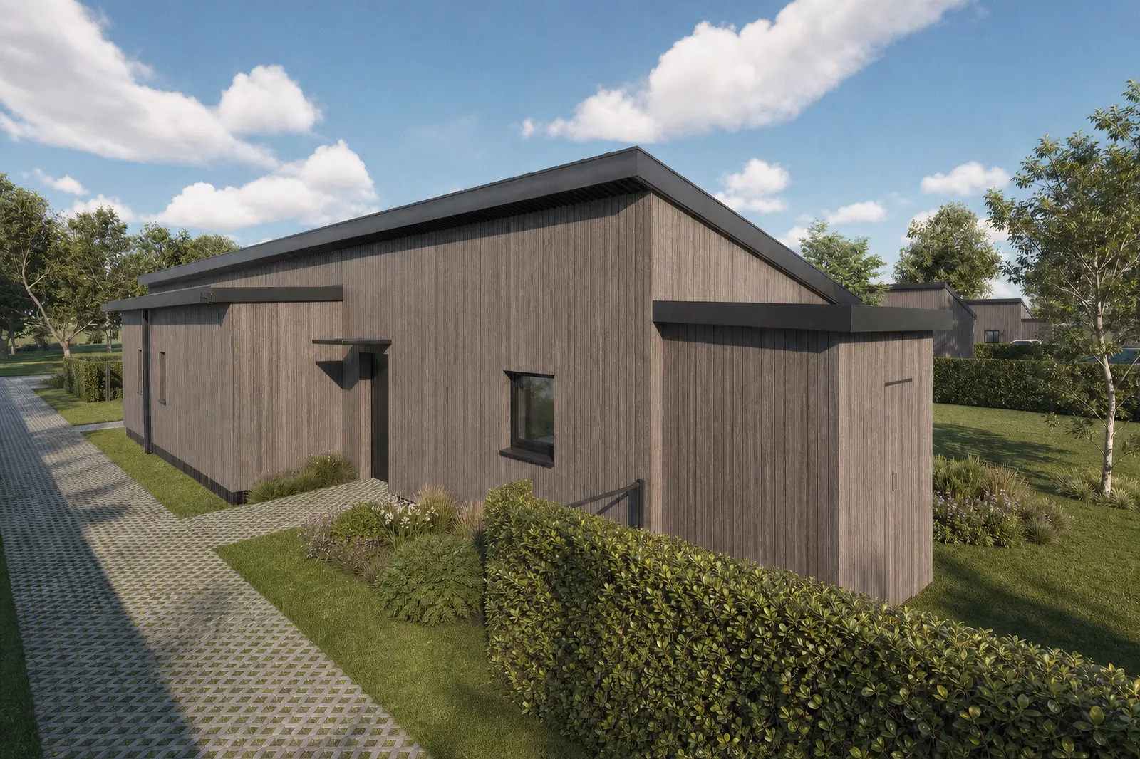 Maison passive de l'éco-quartier vue depuis la venelle, bardage bois et haies bocagères